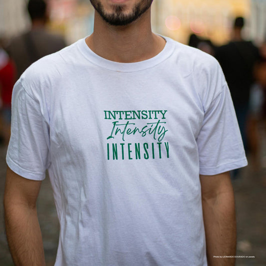 Man wearing a white t-shirt with a green print. Photo by Leonardo Dourado on Pexels