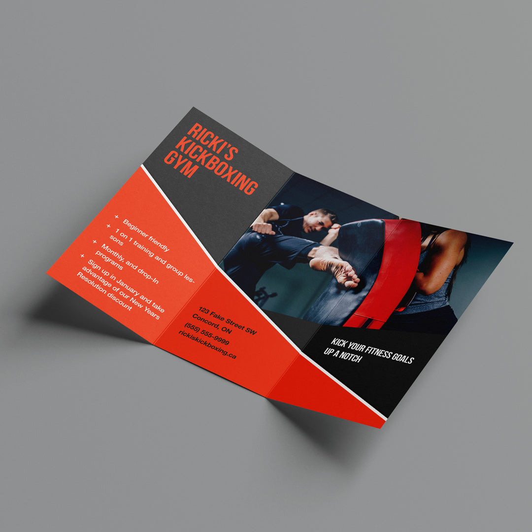 tri-fold brochure for a gym on a grey background