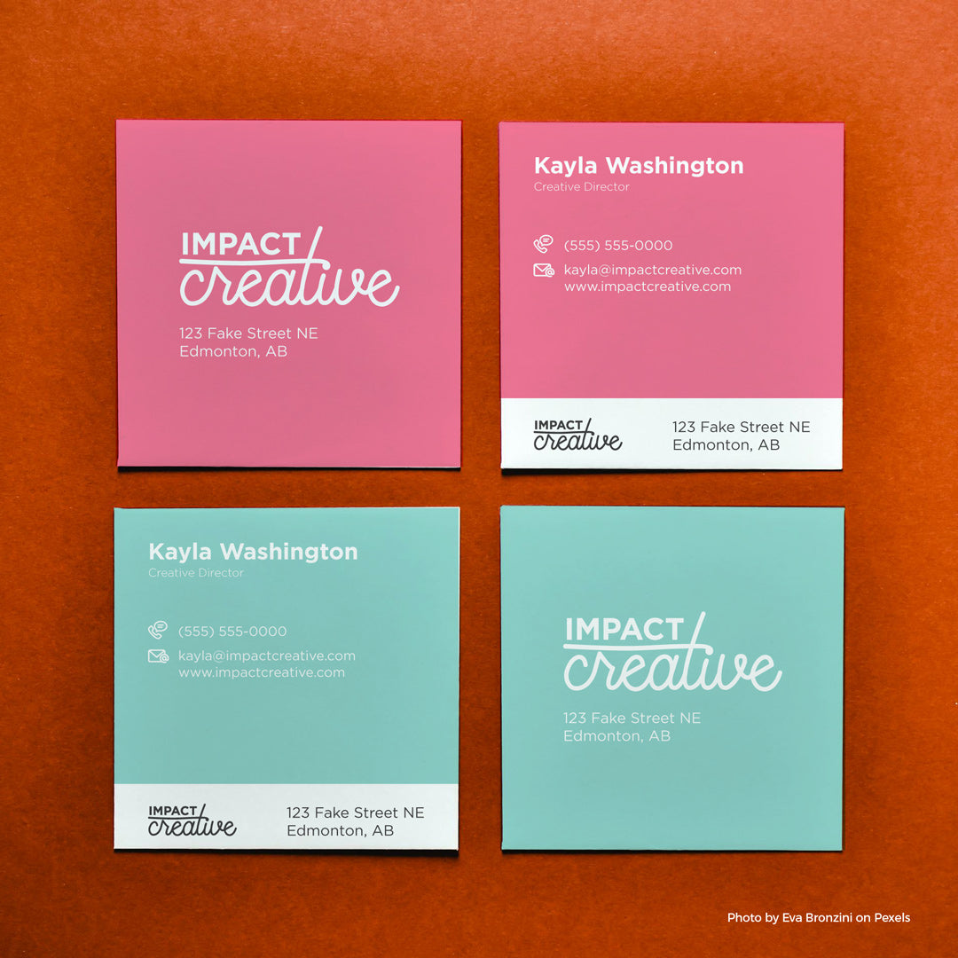 Four square business card mock ups on an orange background